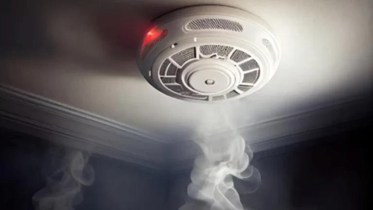 Where to install a smoke detector in the bedroom with a ceiling fan?